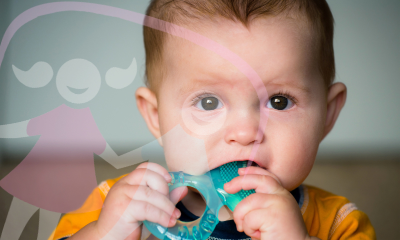 baby chewing on a teething ring